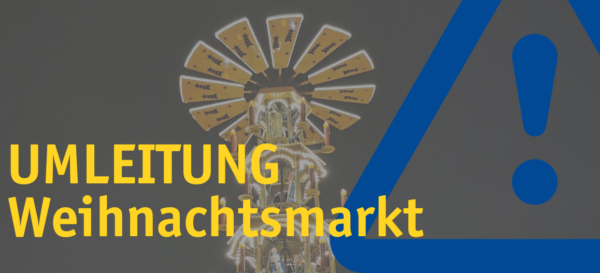 Text "Umleitung Weihnachtmarkt" und Achtung-Symbol vor einem Karussel